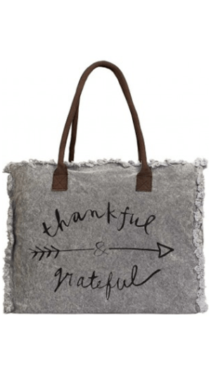 These gorgeous oversized totes are handcrafted with recycled canvas — by Vintage Addiction • Bag is fully lined • One (1) interior pocket • Leather handles Message: “Thankful & grateful” - front view