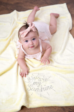 You are my Sunshine baby on yellow blanket